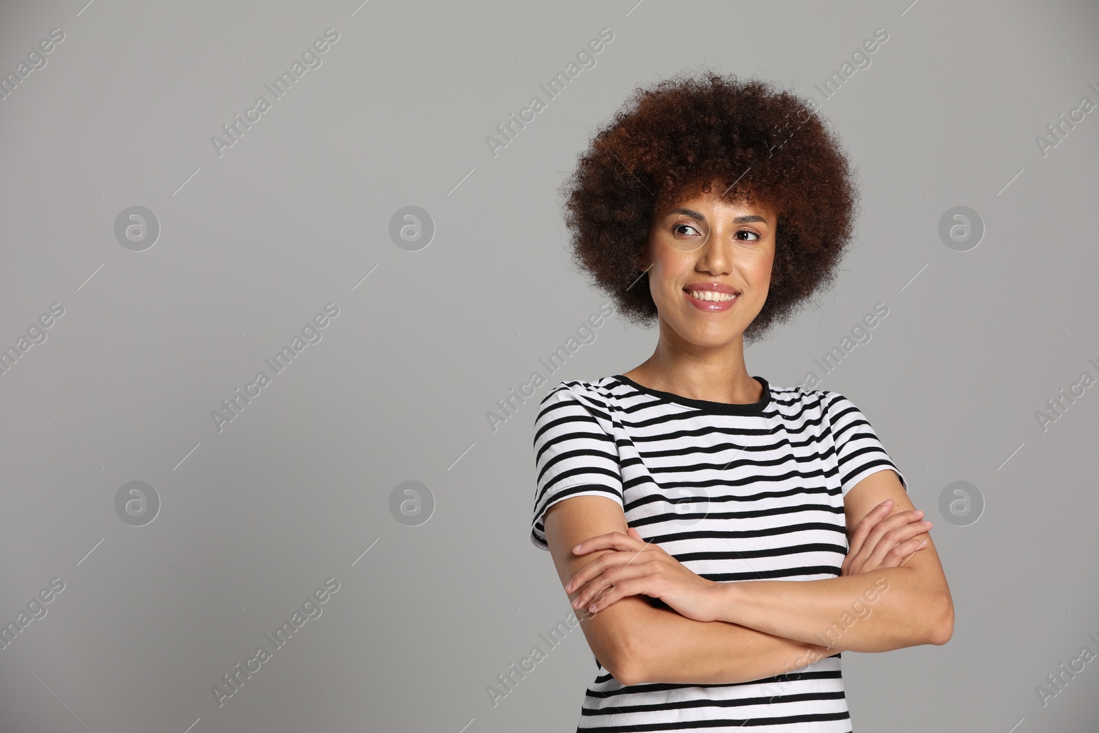 Photo of Portrait of beautiful young woman on grey background. Space for text