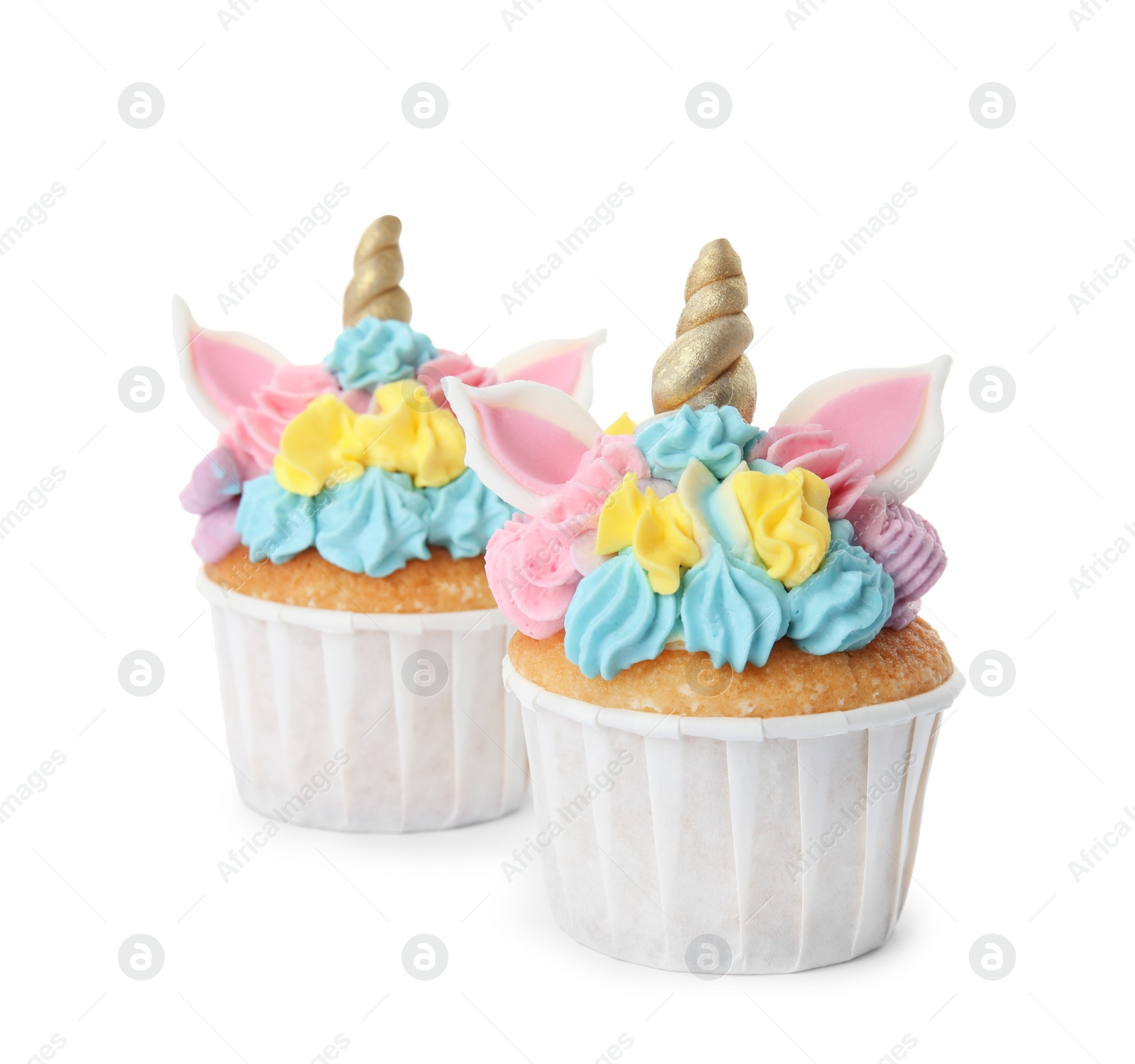 Photo of Two cute sweet unicorn cupcakes on white background