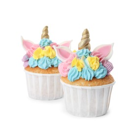 Photo of Two cute sweet unicorn cupcakes on white background