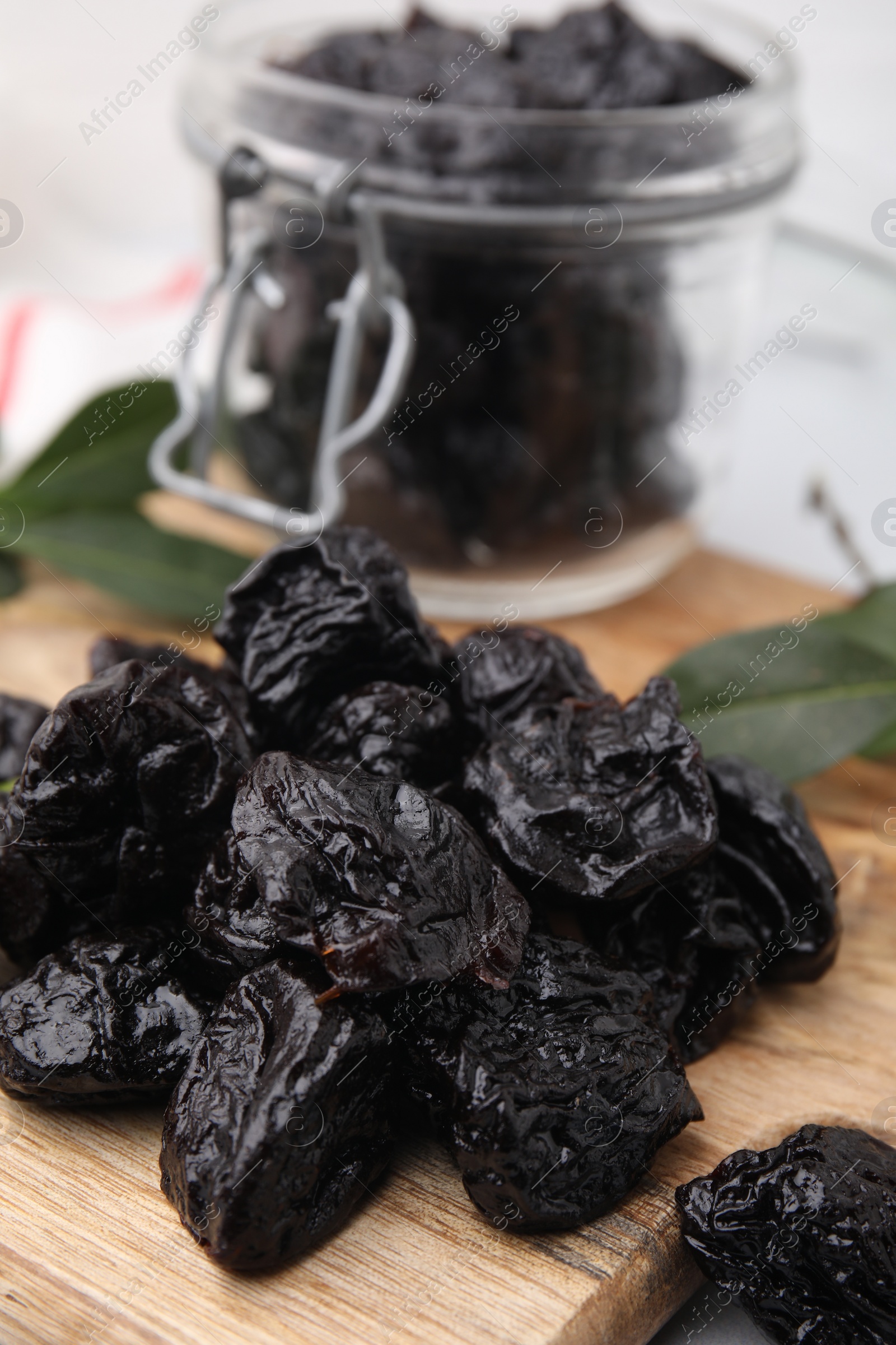 Photo of Tasty dried prunes on table, closeup view
