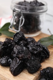 Photo of Tasty dried prunes on table, closeup view