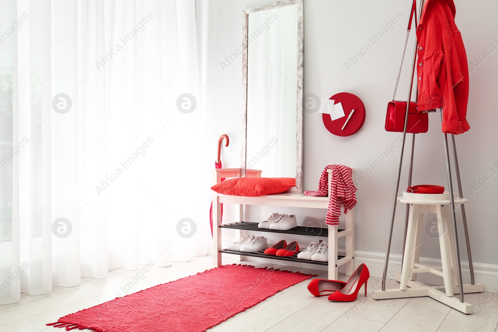 Cozy stylish hallway interior with shoe rack and mirror, space for text. Home design idea Photo of Cozy stylish hallway interior with shoe rack and mirror, space for text. Home design idea