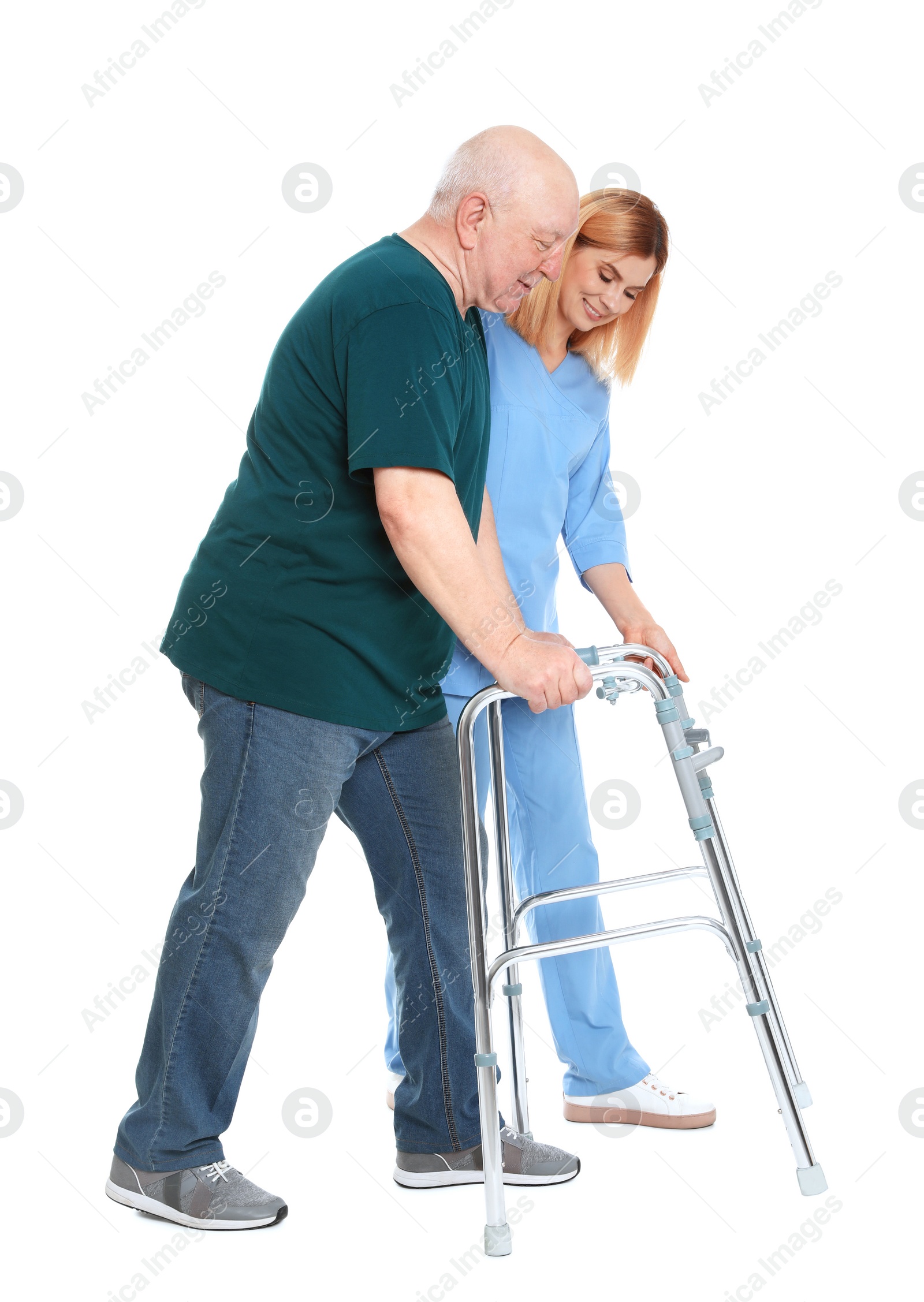 Photo of Caretaker helping elderly man with walking frame on white background