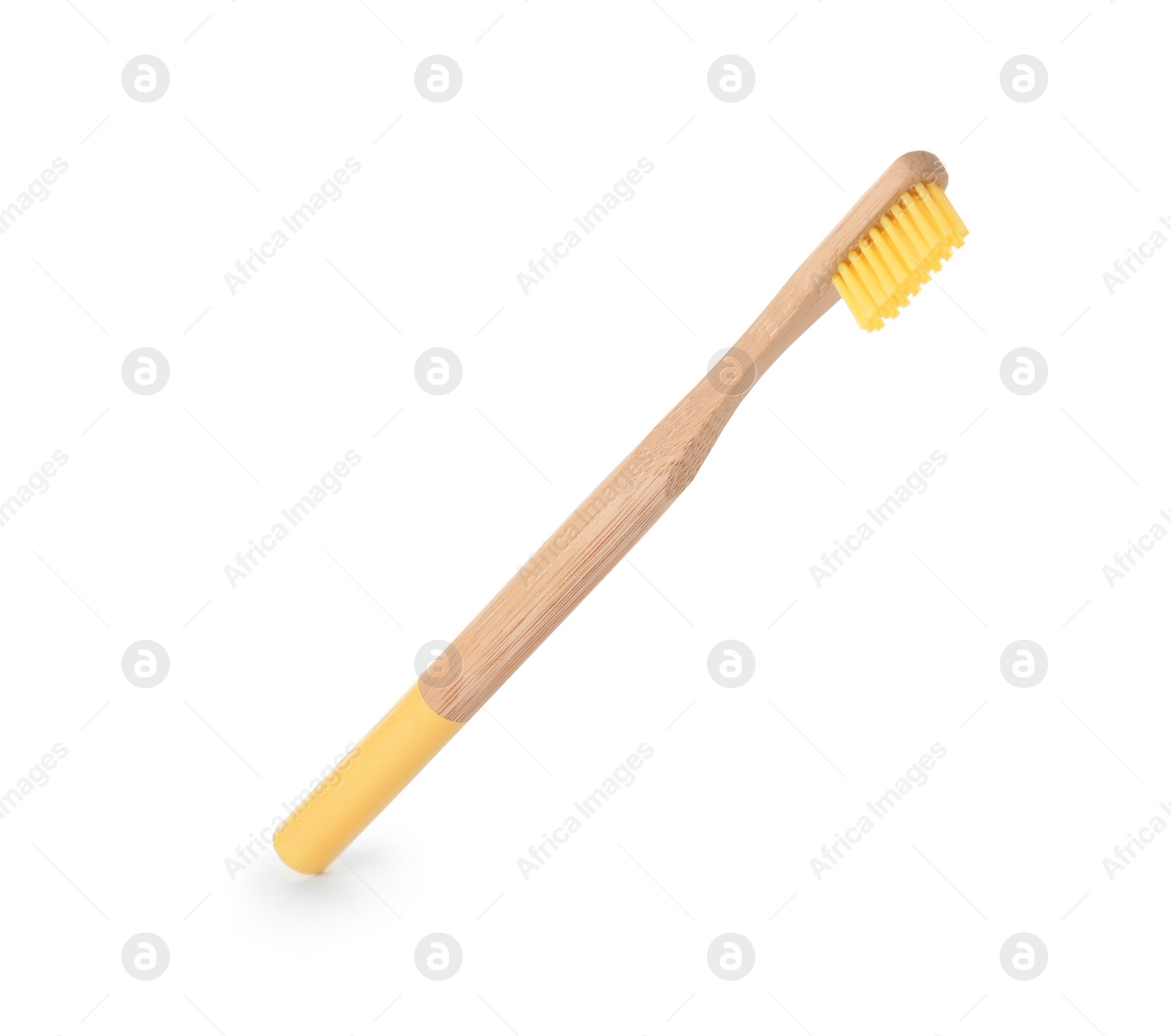 Photo of Bamboo toothbrush on white background. Dental care