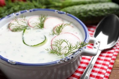 Delicious cold summer soup on table, closeup