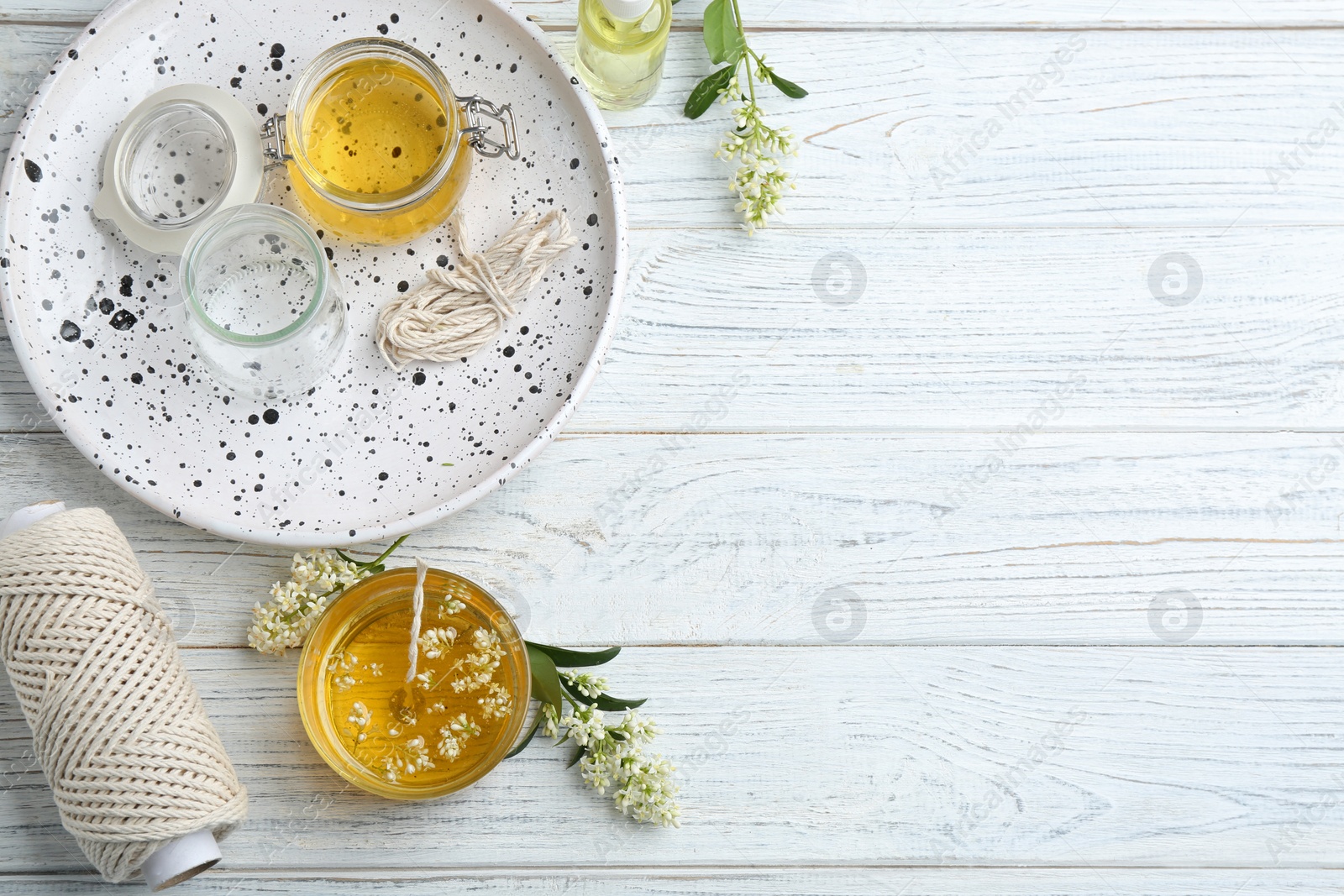 Photo of Flat lay composition with candle on wooden background. Space for text