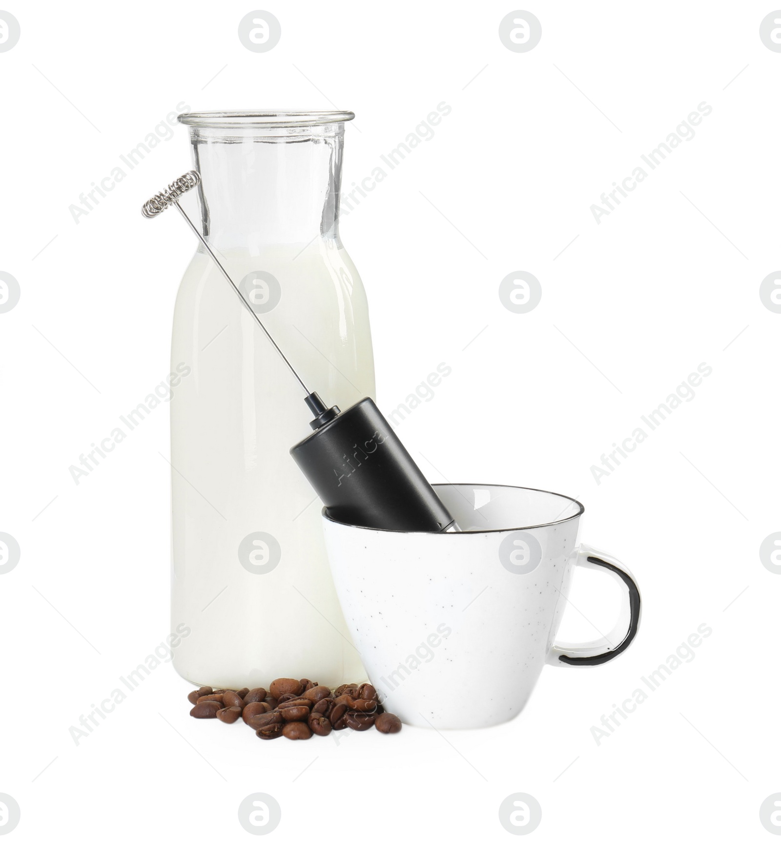 Photo of Mini mixer (milk frother), cup, coffee beans and bottle isolated on white