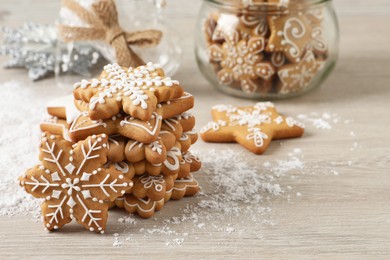 Tasty Christmas cookies on beige wooden table. Space for text