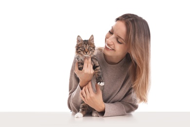 Young woman with cat on white background. Owner and pet