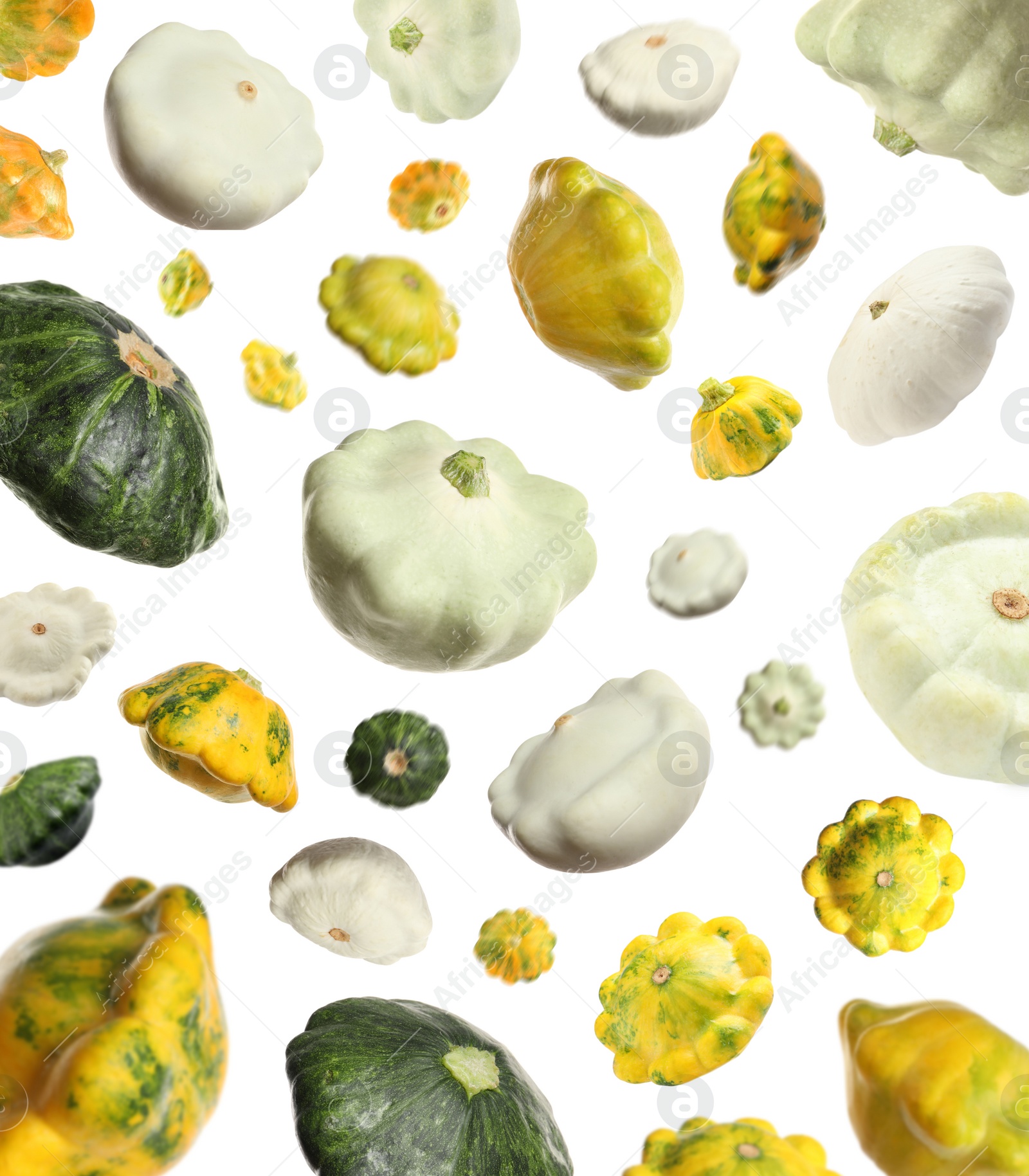 Image of Fresh ripe pattypan squashes falling on white background 