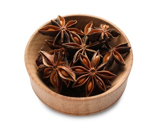 Photo of Aromatic anise stars in wooden bowl isolated on white