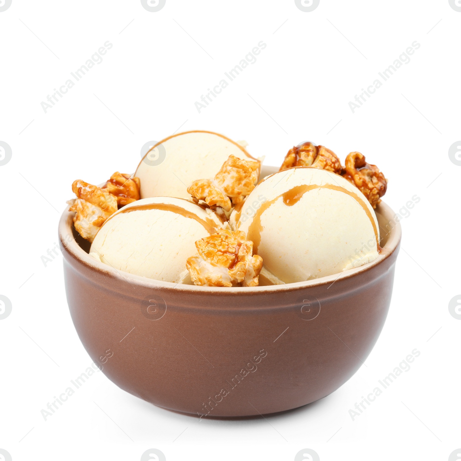 Photo of Delicious ice cream with caramel popcorn and sauce in bowl on white background
