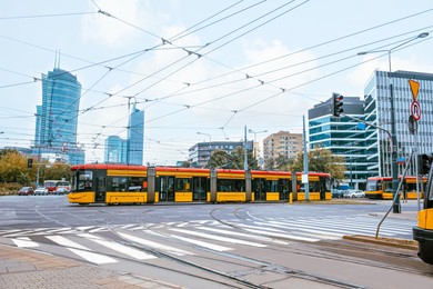 Modern trams on city street. Public transport