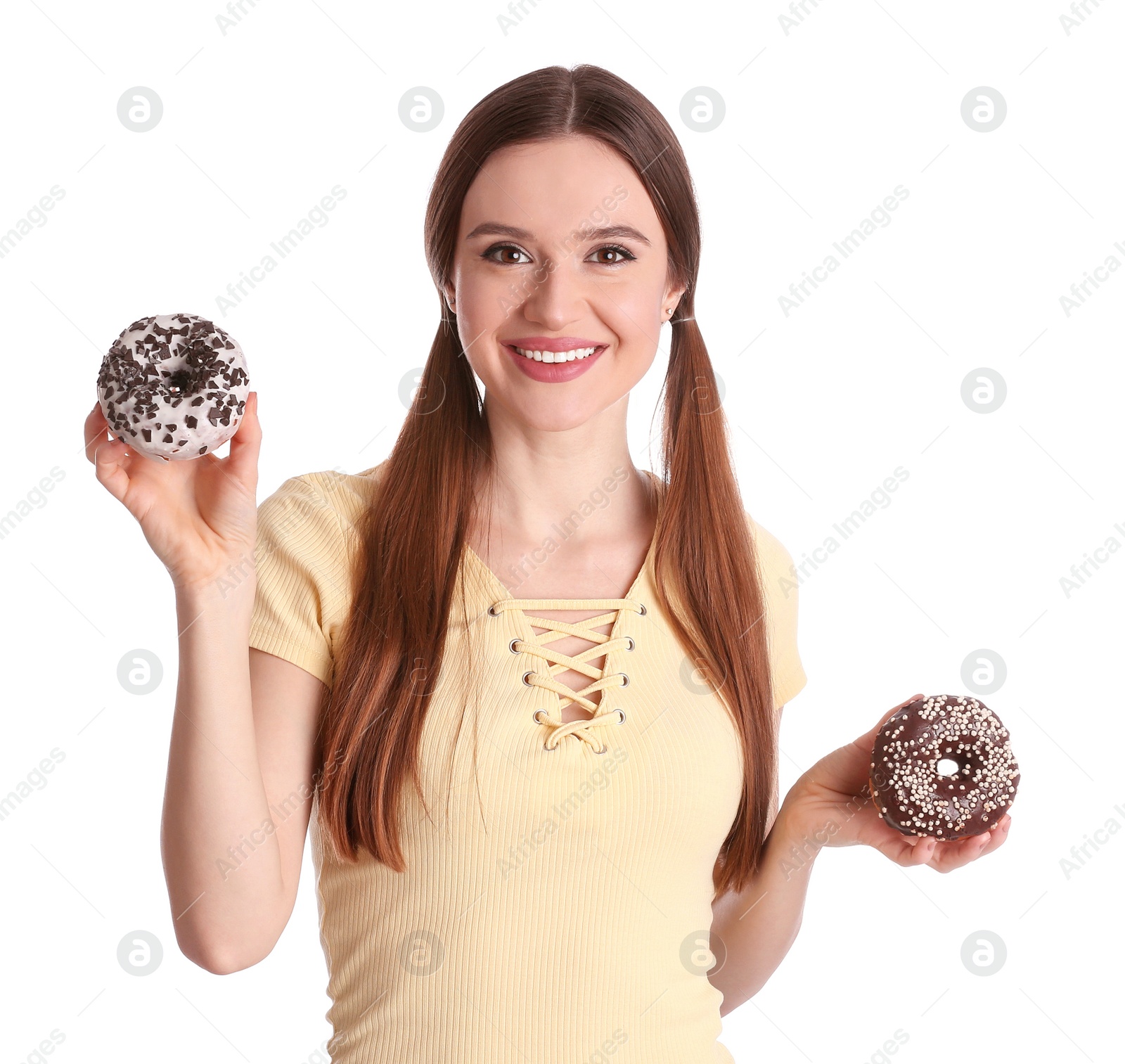 Photo of Beautiful young woman with donuts on white background