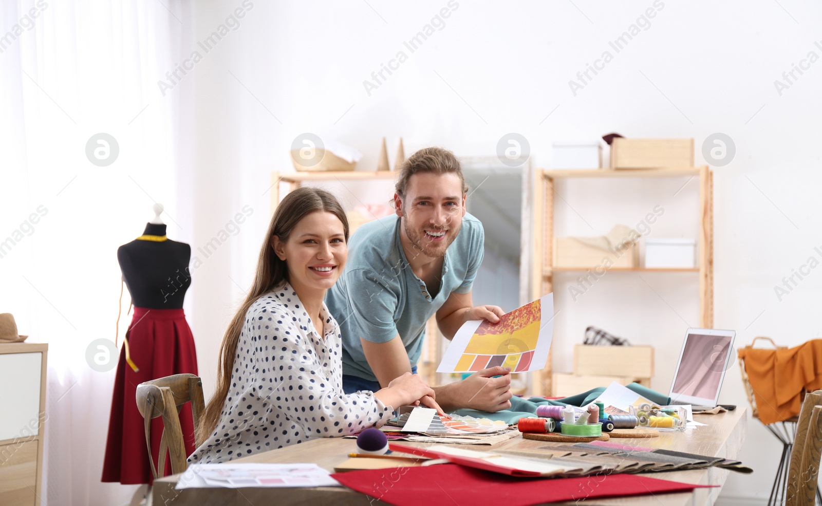 Photo of Fashion designers creating new clothes in studio