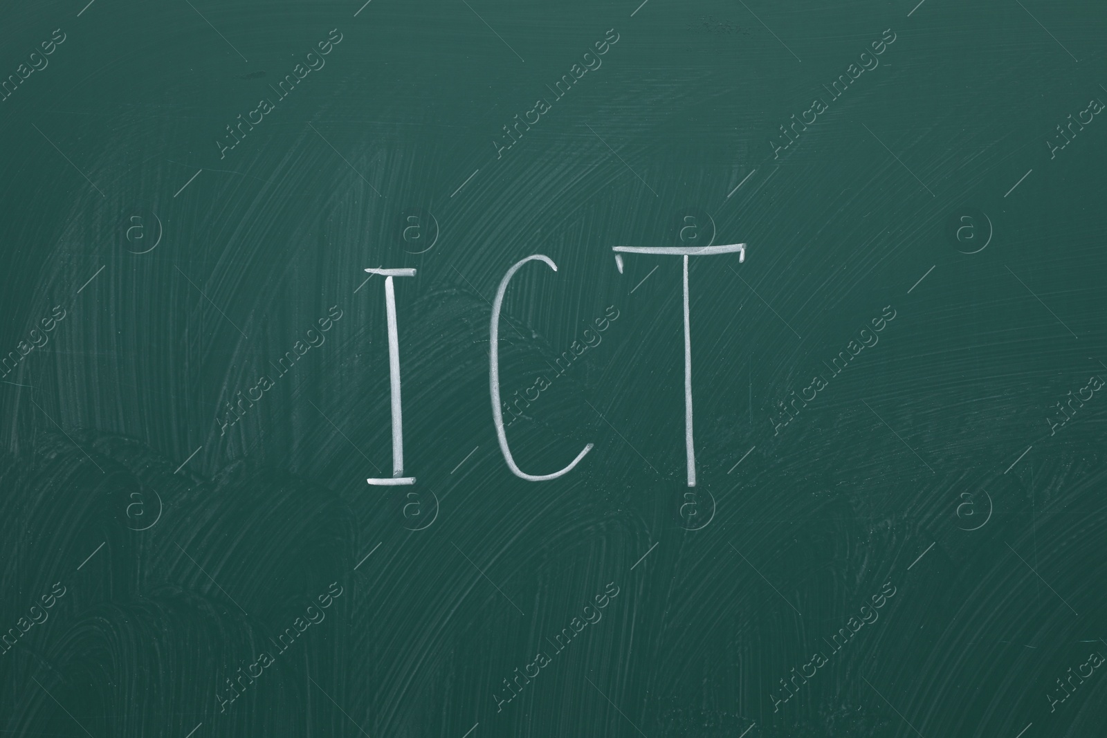 Photo of Abbreviation ICT written with chalk on green board