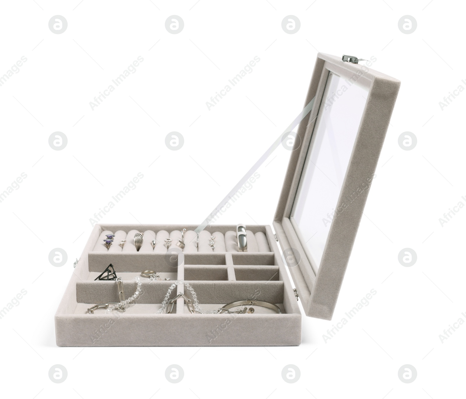 Photo of Jewelry box with many different silver accessories isolated on white