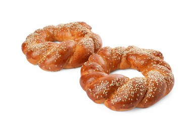 Photo of Round braided breads isolated on white. Fresh pastries