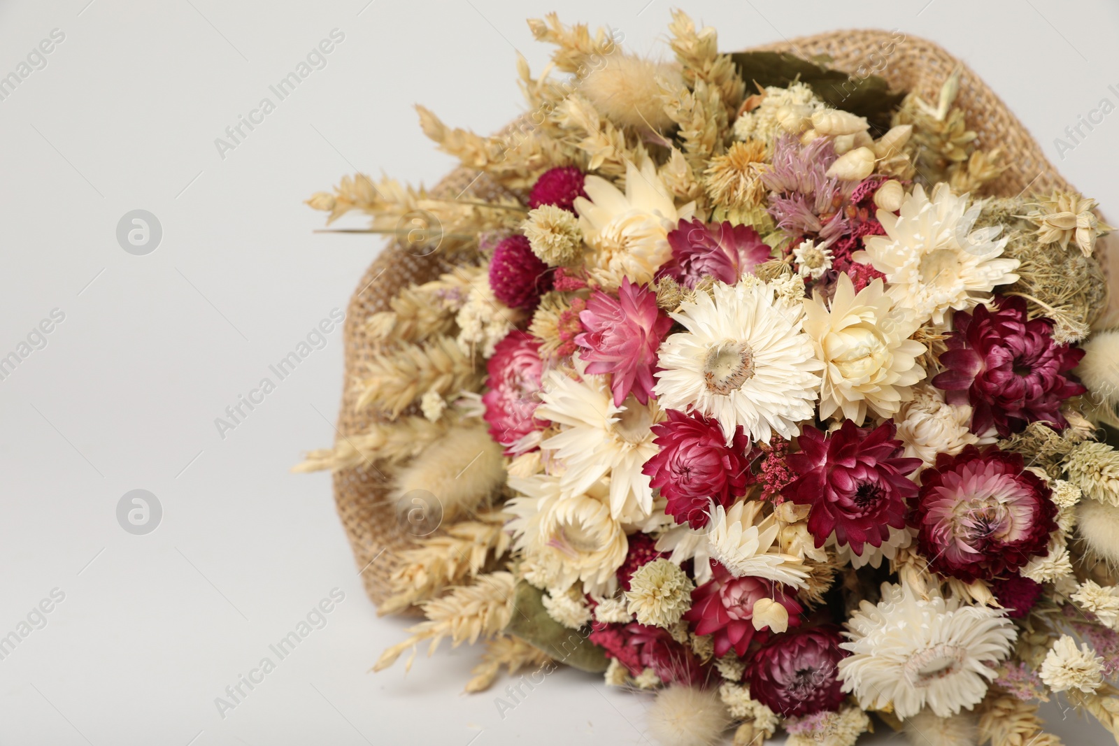 Photo of Beautiful bouquet of dry flowers on white background, space for text