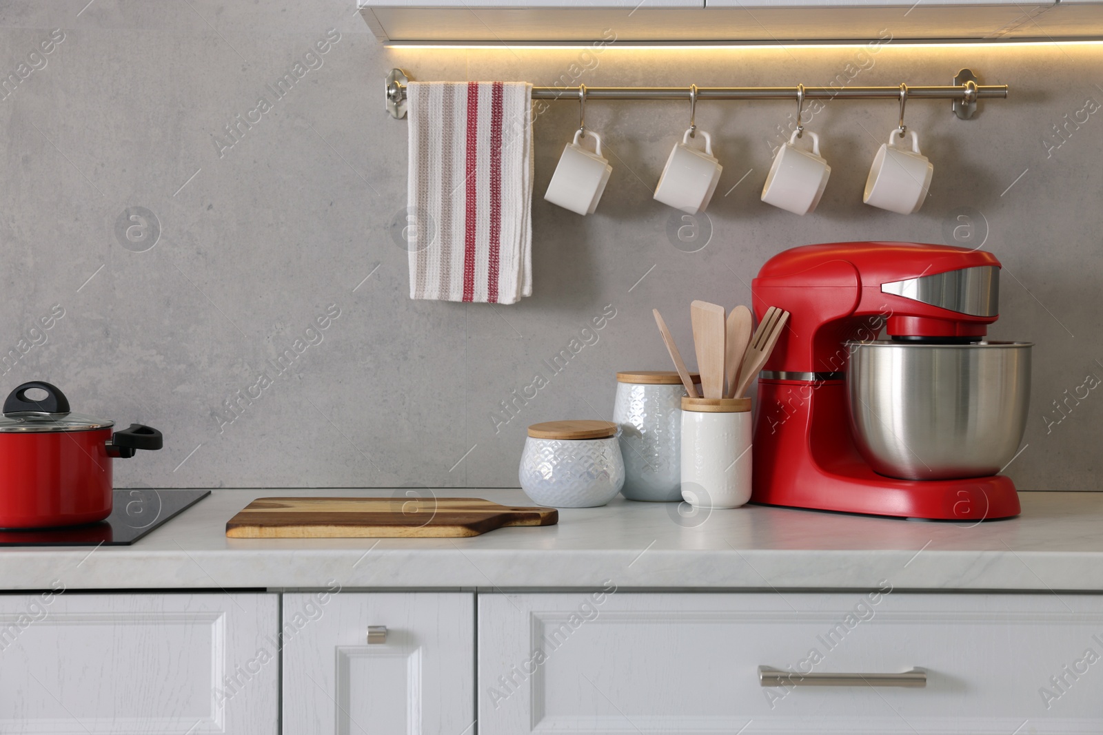 Photo of Set of different utensils on countertop in kitchen