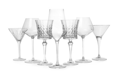 Photo of Elegant martini and wine empty glasses isolated on white