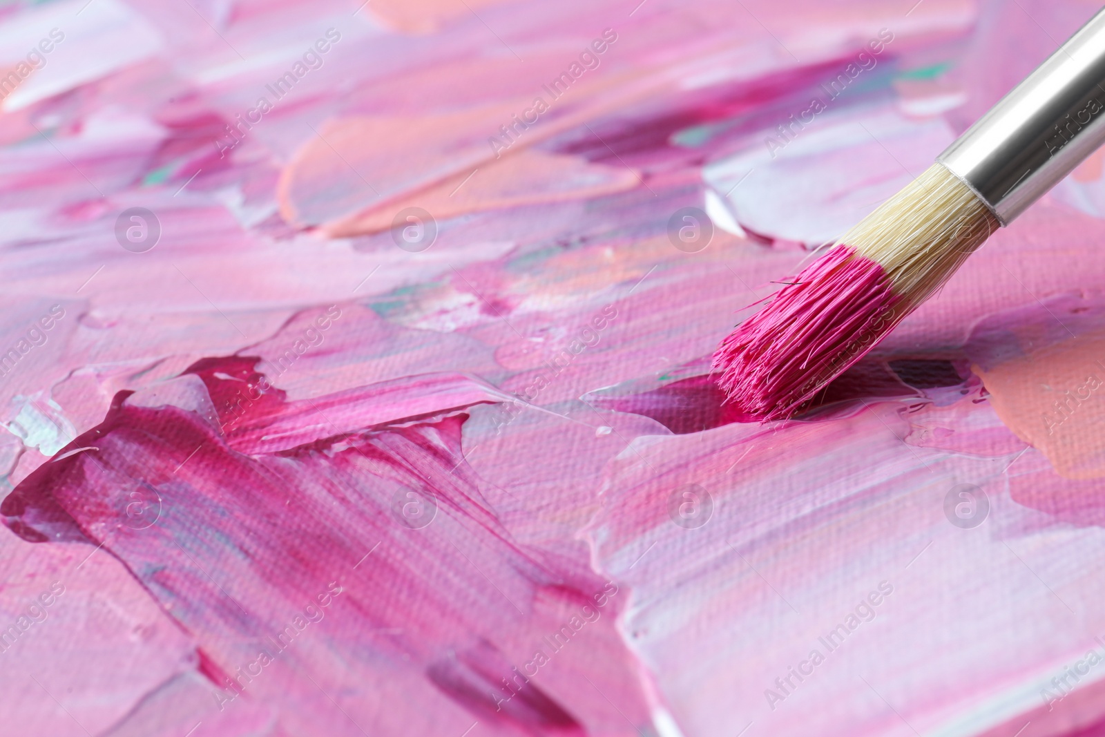 Photo of Abstract colorful paint and brush, closeup view