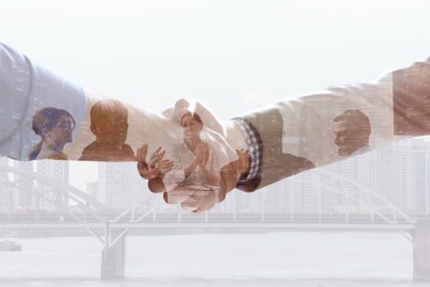 Image of Multiple exposure of partners shaking hands, businesspeople and cityscape