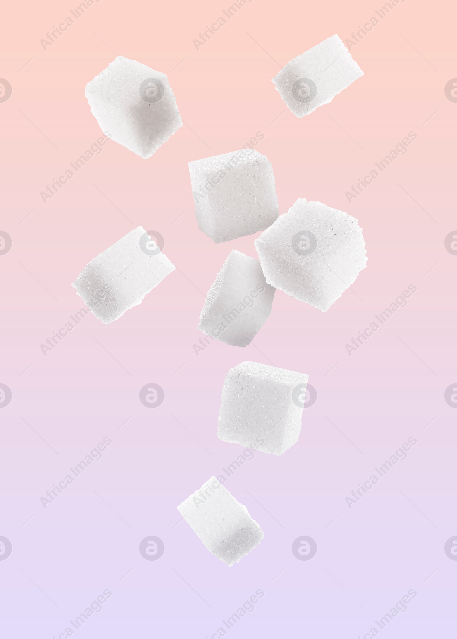 Image of Refined sugar cubes in air on color gradient background