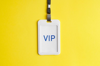 Vip badge on yellow background, top view