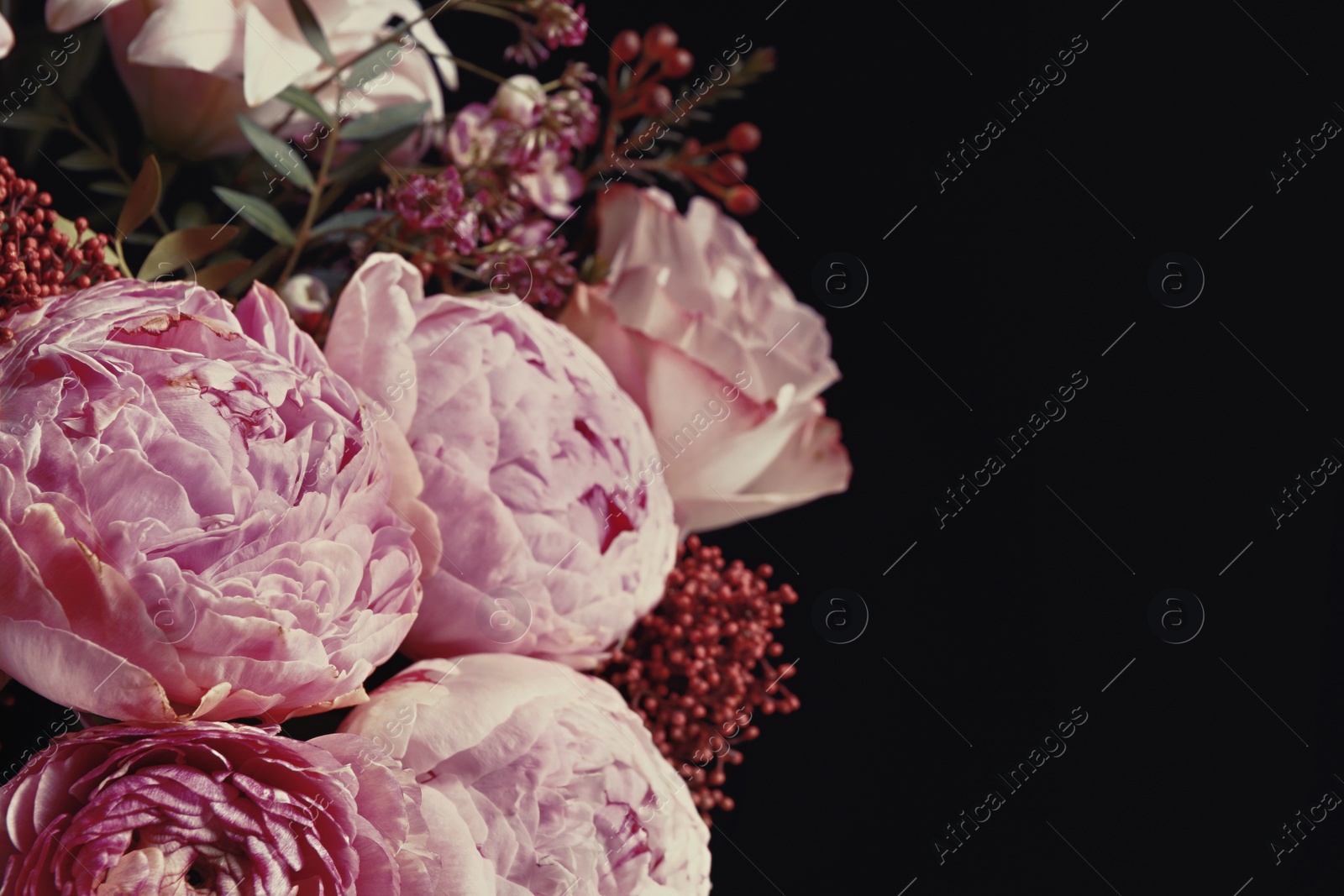 Photo of Beautiful bouquet of different flowers on black background, closeup. Floral card design with dark vintage effect