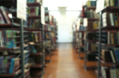 Blurred view of shelving units with books in library