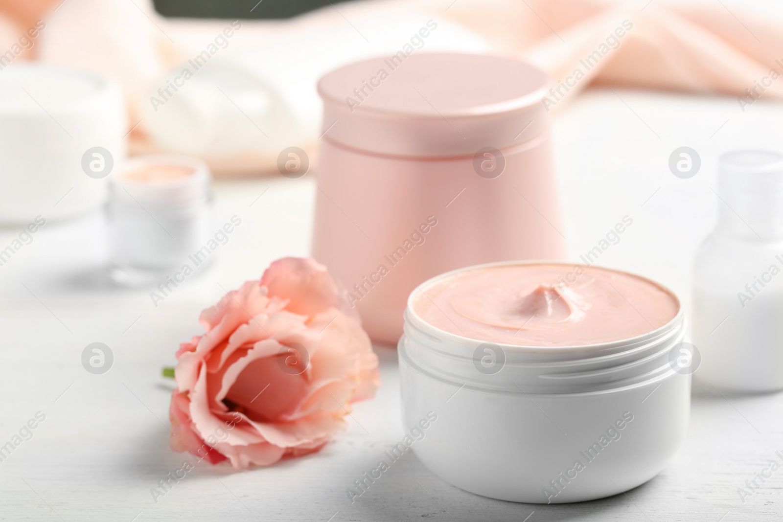 Photo of Closeup view of hand cream jars on table