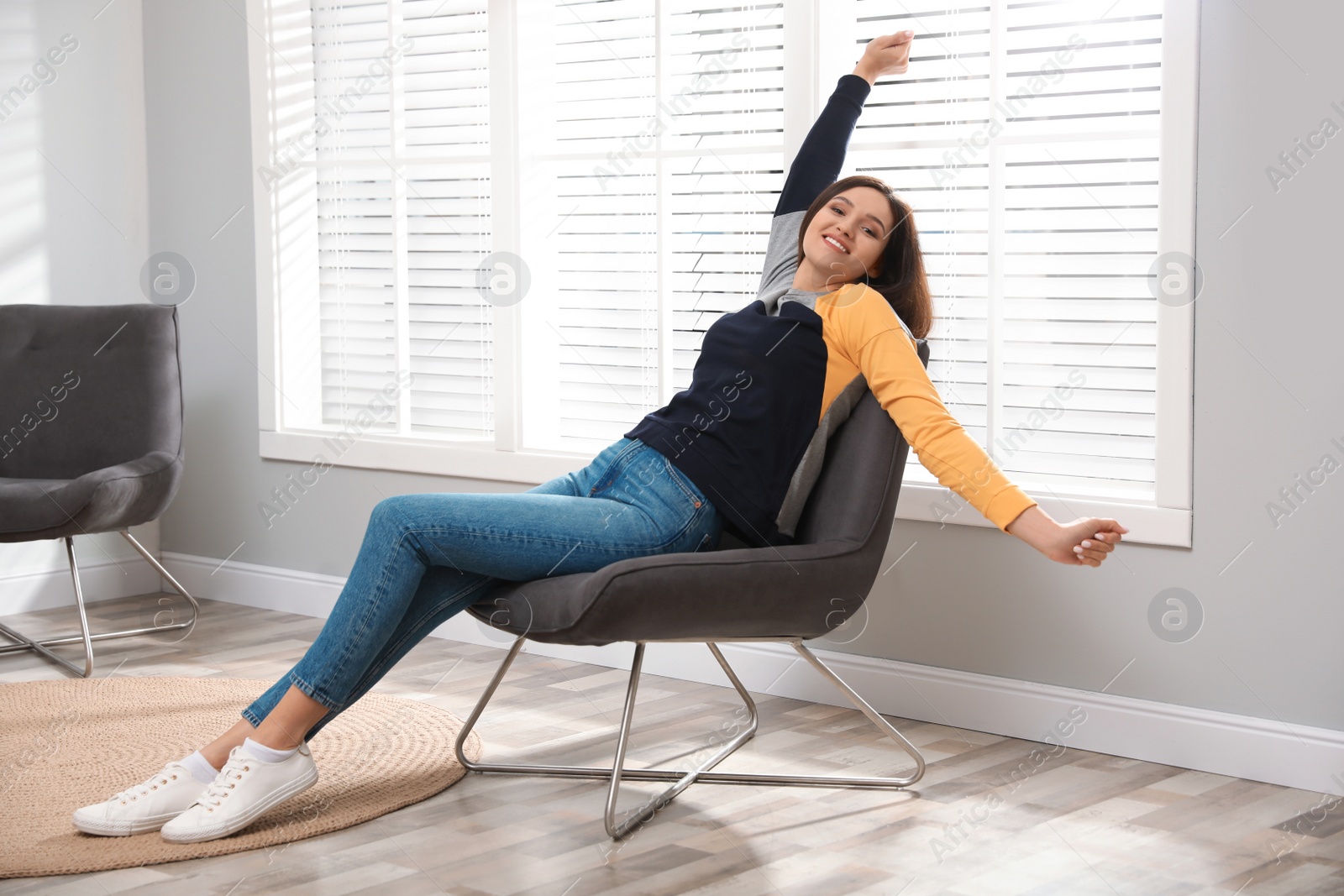 Photo of Young woman relaxing at home. Peaceful rest