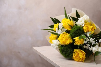 Beautiful bouquet with peony tulips on wooden table. Space for text