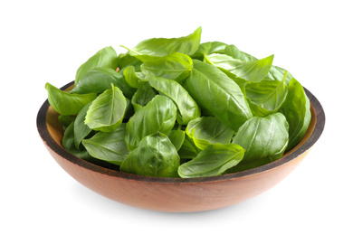 Photo of Fresh basil leaves in wooden bowl isolated on white