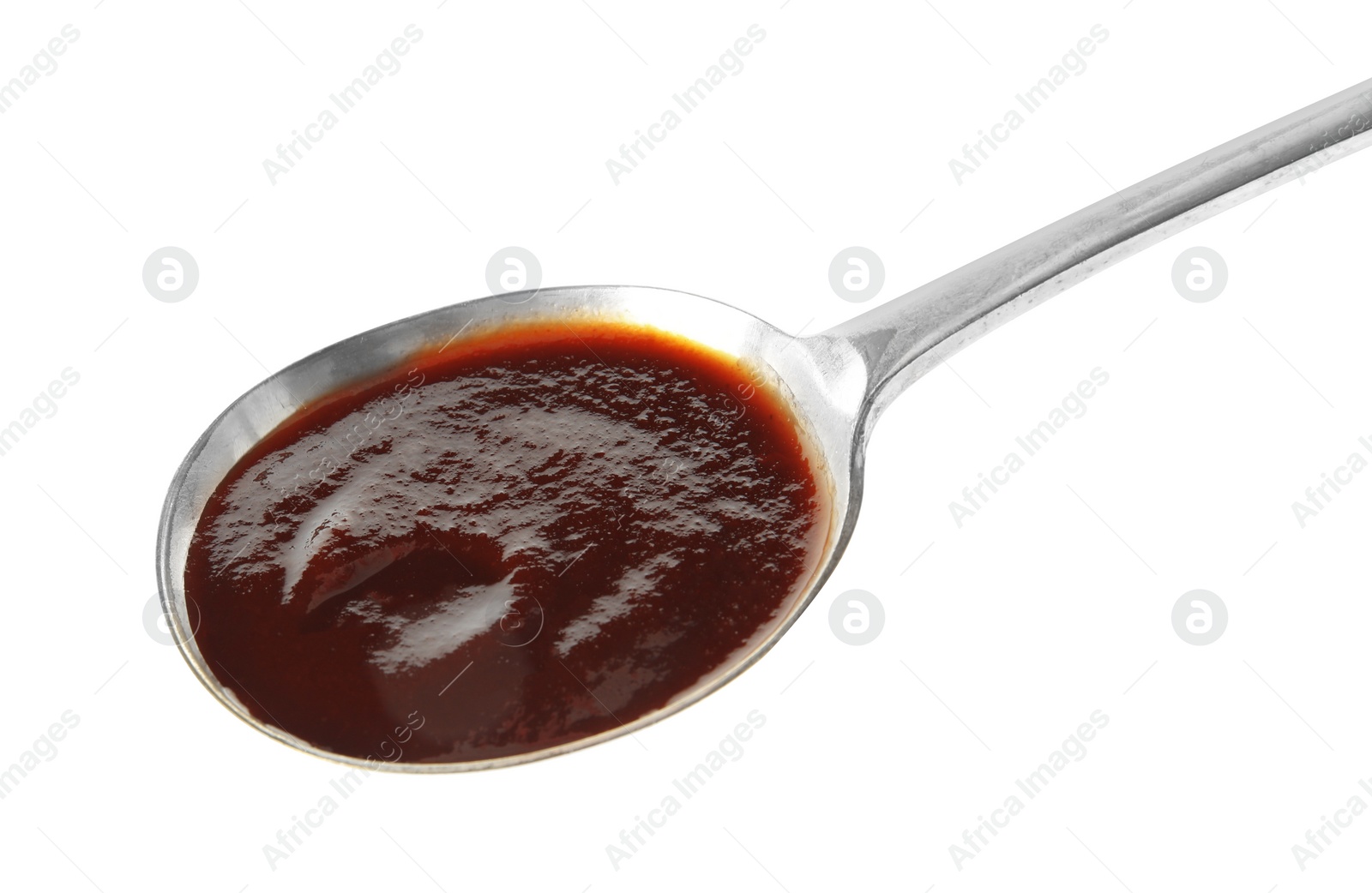 Photo of Spoon with hot barbecue sauce on white background