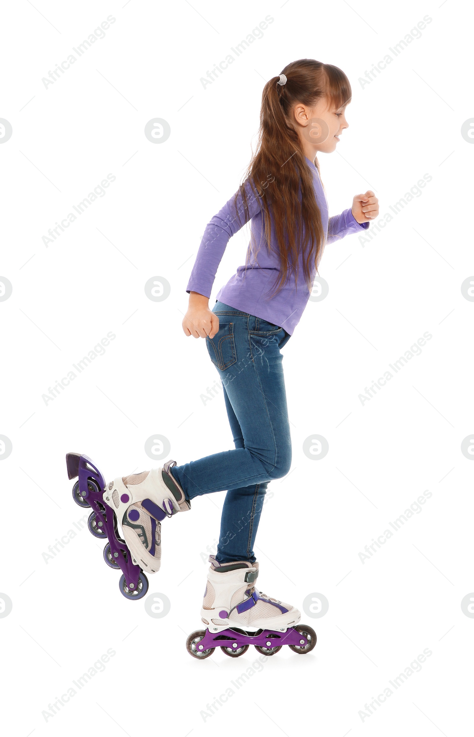 Photo of Little girl with inline roller skates on white background