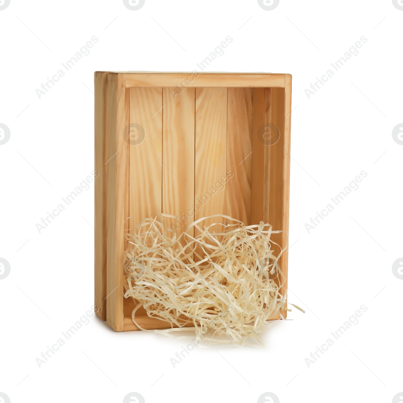 Photo of Wooden crate with shavings on white background