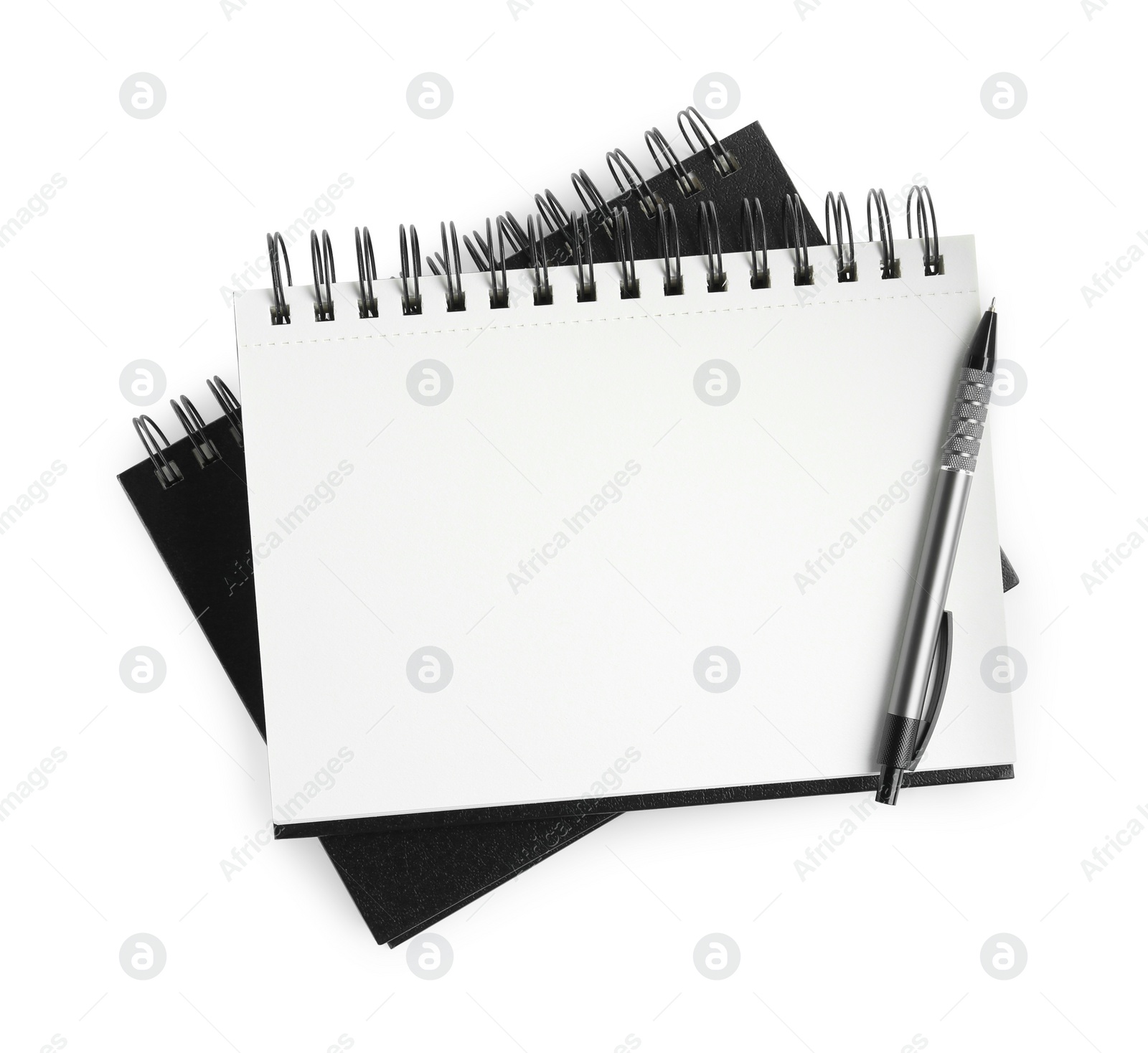 Photo of Two notebooks and pen isolated on white, top view