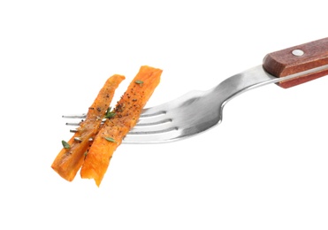 Photo of Fork with tasty sweet potato fries on white background