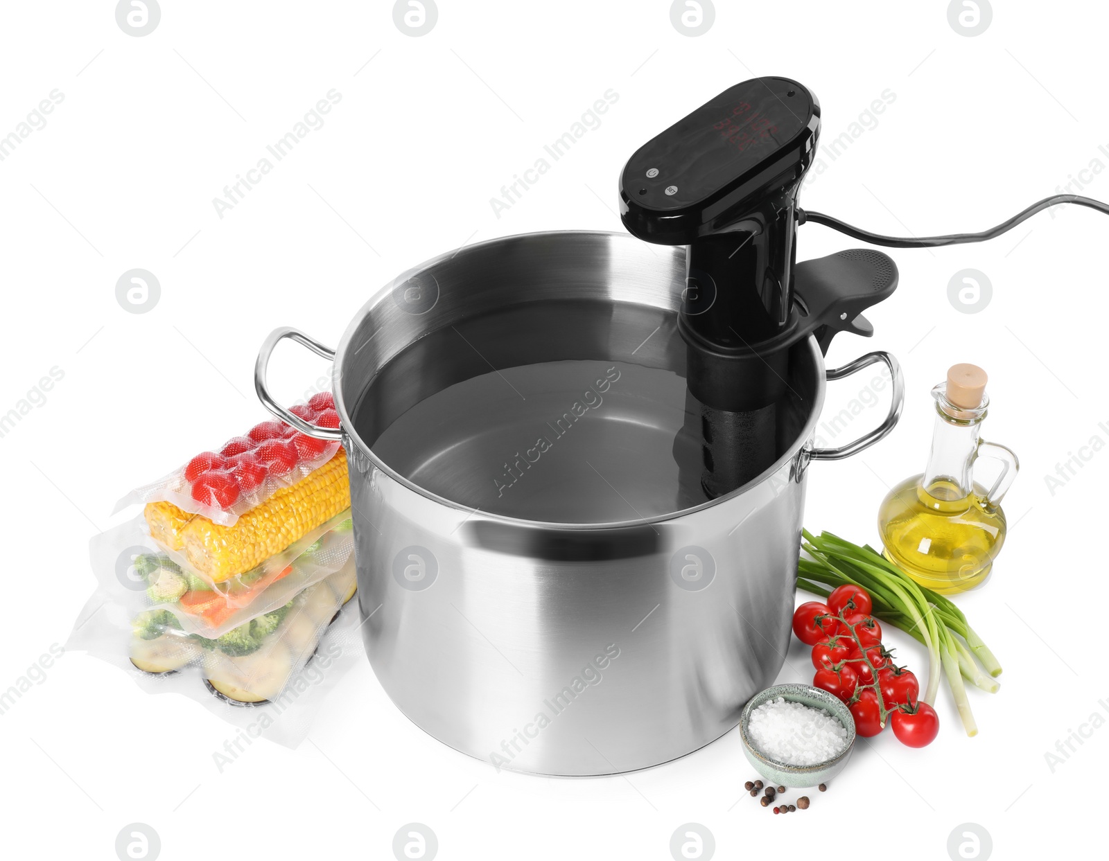 Photo of Thermal immersion circulator in pot and ingredients on white background. Sous vide cooking