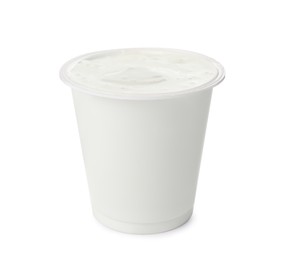 Photo of Delicious organic yogurt in plastic cup isolated on white