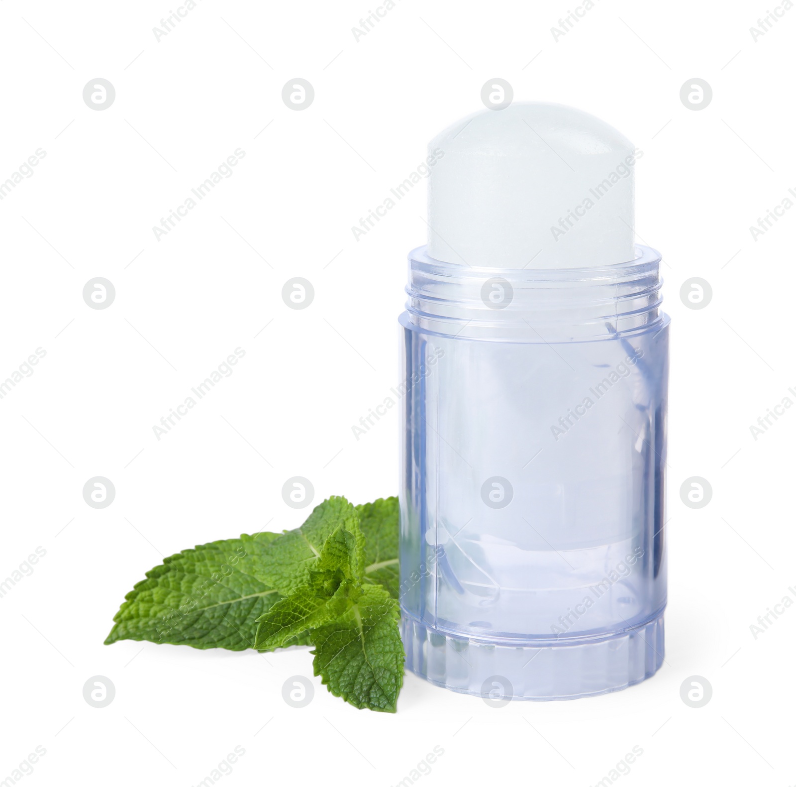 Photo of Natural crystal alum deodorant and mint on white background