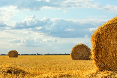 Beautiful view of agricultural field with hay bales