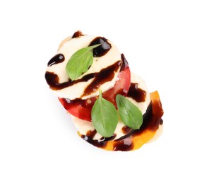 Photo of Delicious bruschetta with mozzarella cheese, tomatoes and balsamic vinegar isolated on white, top view