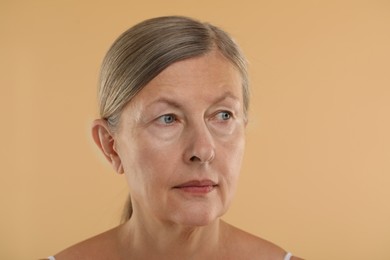 Woman with normal skin on beige background