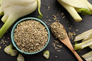 Photo of Fennel seeds in bowl, whole and cut vegetables on gray table, flat lay