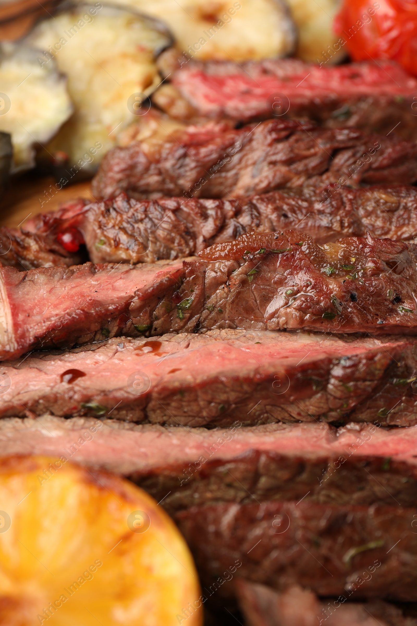 Photo of Delicious grilled beef steak with spices on table, closeup