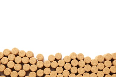 Photo of Wine bottle corks on white background, top view