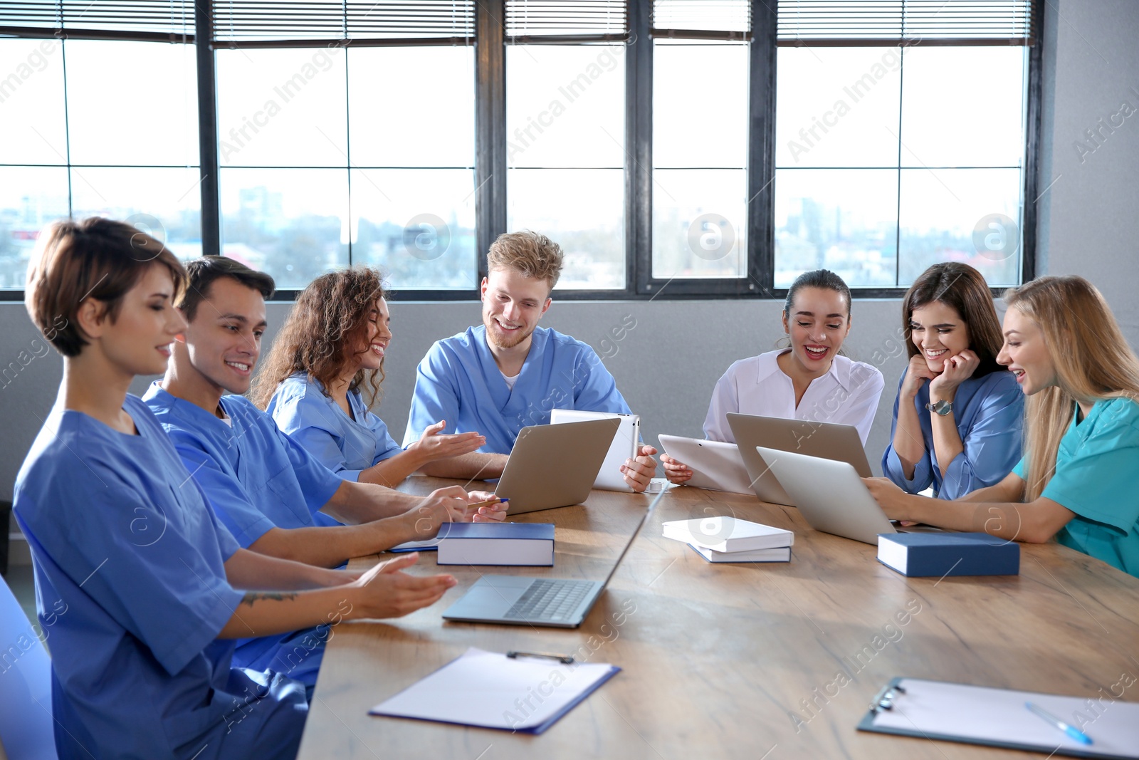 Photo of Group of smart medical students with gadgets in college